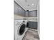 Laundry room with cabinets, countertops, washer, and dryer at 11 Caminito Amore, Henderson, NV 89011