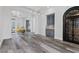 Stylish living room with tile floors, a built-in bar, and wrought-iron door wine storage at 11 Caminito Amore, Henderson, NV 89011