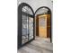 Wine cellar with custom wrought-iron gate and wooden wine racks at 11 Caminito Amore, Henderson, NV 89011
