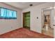 The carpeted bedroom has closet space and windows with curtains at 1317 Pyramid Dr, Las Vegas, NV 89108