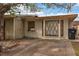 Single-story home featuring a unique diamond-paned window and secured entry gate at 1317 Pyramid Dr, Las Vegas, NV 89108