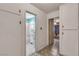 Hallway showing access to bathroom and another room, cabinets on the wall for storage at 1317 Pyramid Dr, Las Vegas, NV 89108