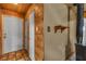 Hallway featuring wood paneling leading to the front door and showing wall features at 1317 Pyramid Dr, Las Vegas, NV 89108