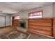 View of a living room featuring a brick fireplace and built-in bookshelves at 1317 Pyramid Dr, Las Vegas, NV 89108