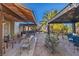 Expansive backyard showcasing patios, desert landscaping, and ample seating options at 146 Cascade Dr, Henderson, NV 89074