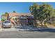 Charming single-story home featuring a two-car garage, a car parked in the driveway, and mature landscaping at 146 Cascade Dr, Henderson, NV 89074