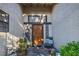 Close-up of the front door with sidelights and a decorative statue, offering a warm welcome at 146 Cascade Dr, Henderson, NV 89074