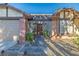 Inviting front entrance with a security gate, brick accents, and decorative landscaping at 146 Cascade Dr, Henderson, NV 89074