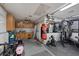 Spacious garage featuring an assortment of gym equipment, scooters, and a punching bag at 146 Cascade Dr, Henderson, NV 89074