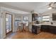 The kitchen shows dark cabinets, a breakfast table, and wood floors at 146 Cascade Dr, Henderson, NV 89074