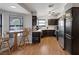 Bright kitchen features wood floors, dark cabinets, and stainless steel appliances at 146 Cascade Dr, Henderson, NV 89074