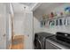 Laundry room featuring washer and dryer, utility storage, and entryway at 146 Cascade Dr, Henderson, NV 89074