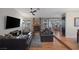 Spacious living room with a brick fireplace, ceiling fan, and a comfortable seating arrangement at 146 Cascade Dr, Henderson, NV 89074