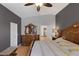Bedroom with wood floors, a dresser, and a dark accent wall at 146 Cascade Dr, Henderson, NV 89074