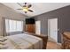 Bedroom features a ceiling fan, wood floors, and an ensuite bathroom at 146 Cascade Dr, Henderson, NV 89074