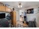 Cozy office features wallpaper, hardwood flooring, and an entertainment center at 146 Cascade Dr, Henderson, NV 89074