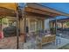 Charming patio with seating, outdoor grill, and views of landscaped backyard at 146 Cascade Dr, Henderson, NV 89074
