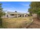 Home exterior featuring a backyard with large patio and luscious trees at 1513 Marita Dr, Boulder City, NV 89005