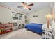 The bedroom includes carpet, a ceiling fan, a window, and built-in shelves at 1513 Marita Dr, Boulder City, NV 89005