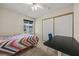Bright bedroom featuring a ceiling fan, large closet, and view to the outdoors at 1513 Marita Dr, Boulder City, NV 89005