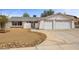 Charming single-story home with a two-car garage, low-maintenance landscaping, and a desert-style front yard at 1513 Marita Dr, Boulder City, NV 89005