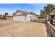 Home exterior showcasing a three car garage and gated side yard at 1513 Marita Dr, Boulder City, NV 89005
