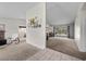Open-concept living room with tile flooring, carpet, a breakfast bar, and access to the backyard at 1513 Marita Dr, Boulder City, NV 89005