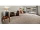 Spacious living area with a breakfast bar, a sliding glass door, neutral carpet, and comfortable seating at 1513 Marita Dr, Boulder City, NV 89005
