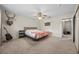 The main bedroom includes carpet, a ceiling fan, and access to the closet and bathroom at 1513 Marita Dr, Boulder City, NV 89005