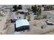 Aerial view of a property including the home, outbuildings, and surrounding landscape at 1540 Labrador St, Pahrump, NV 89048