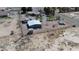 Wide aerial view of a rural neighborhood, highlighting large lots and various outbuildings and homes at 1540 Labrador St, Pahrump, NV 89048
