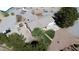 Aerial view of single story home with large lot, spacious driveway and surrounding buildings at 1540 Labrador St, Pahrump, NV 89048
