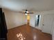 This bedroom includes wood laminate flooring and two access doors at 1540 Labrador St, Pahrump, NV 89048