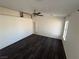 The spacious bedroom features dark laminate floors and a ceiling fan at 1540 Labrador St, Pahrump, NV 89048