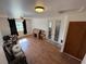 Bedroom with hardwood floors, double doors with windows, and a closet at 1540 Labrador St, Pahrump, NV 89048