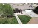 Charming home featuring a well-kept lawn and a cozy front porch with seating at 1540 Labrador St, Pahrump, NV 89048