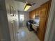 This laundry room has a utility sink and washer and dryer hookups at 1540 Labrador St, Pahrump, NV 89048