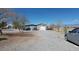 Outbuilding for vehicles and storage on a large gravel lot at 1540 Labrador St, Pahrump, NV 89048