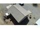 Aerial view showing a tile roofed outbuilding and discarded vehicles at 1540 Labrador St, Pahrump, NV 89048