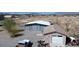 Aerial view showing two outbuildings; a large shop and a smaller garage or storage space at 1540 Labrador St, Pahrump, NV 89048