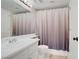 Bathroom with a modern vanity, toilet, and shower featuring a decorative shower curtain at 1709 Autumn Rust Dr, Las Vegas, NV 89119