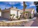 Single-story home with desert landscaping and a two-car garage at 1709 Autumn Rust Dr, Las Vegas, NV 89119