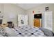 Bright main bedroom with vaulted ceilings, tiled floors, and multiple access points at 1709 Autumn Rust Dr, Las Vegas, NV 89119