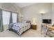 Comfortable main bedroom with neutral tones, vaulted ceilings, and a functional desk area at 1709 Autumn Rust Dr, Las Vegas, NV 89119