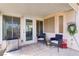 A covered patio featuring outdoor furniture, with views of the backyard at 1709 Autumn Rust Dr, Las Vegas, NV 89119