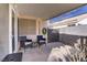 A covered patio with outdoor furniture provides a relaxing outdoor space at 1709 Autumn Rust Dr, Las Vegas, NV 89119