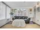 Inviting sunroom with a plush sofa, bright windows, and a cozy atmosphere at 1709 Autumn Rust Dr, Las Vegas, NV 89119