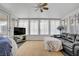 Bright sunroom with comfortable seating and large windows offering ample sunlight at 1709 Autumn Rust Dr, Las Vegas, NV 89119