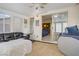 Relaxing sunroom showcasing comfortable seating and plenty of natural light at 1709 Autumn Rust Dr, Las Vegas, NV 89119