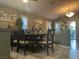 Traditional dining room with an elegant chandelier and a dark wood dining table at 1800 Quail Point Ct, Las Vegas, NV 89117